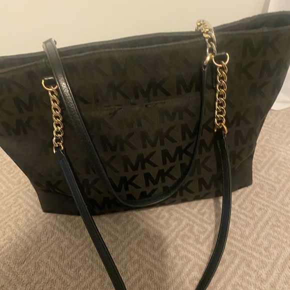 Black Michael Kors purse. Great size. Used with some normal wear and tear. - Picture 2 of 5
